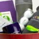 A collection of branded promotional items in a bowl engraved with the words “Happy & Healthy”